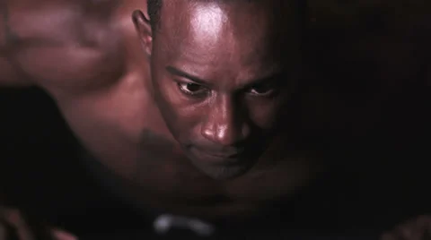 Man exercising with press ups black background Vídeo Stock 32957251