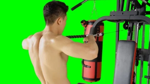 Man exercising by pulling weight on gym machine Stock Footage 107799175