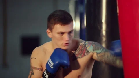 Man Exercising With the Punching Bag Stock-Footage 60139480
