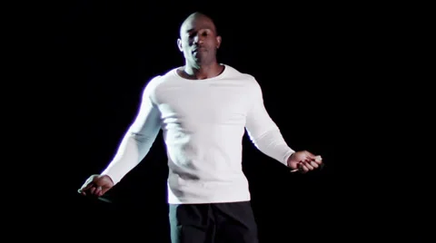Man exercising skipping rope on black background Vídeo Stock 32956864