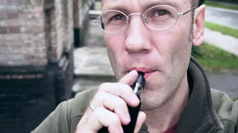 Man exhaling e-cigarette smoke cloud from mouth Stock Footage 68068828