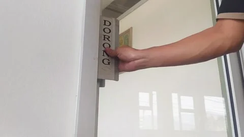 Man Exiting Room and Locking Glass Door with Push Sign Stock Footage 341846802