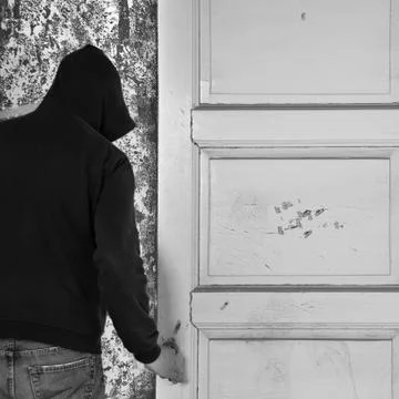 Man exiting through door Fotos de archivo