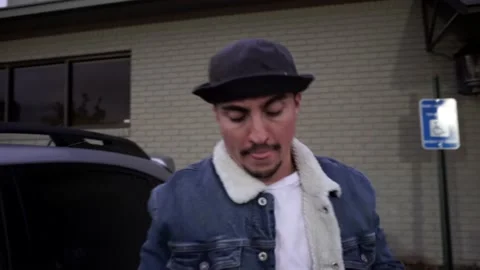 Man Exits Car and Wears Mask During Coronavirus COVID-19 Pandemic Stock Footage 142487581