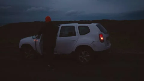 Man Experiencing Car Breakdown in Remote Icelandic Landscape Stockbeeldmateriaal 307360742