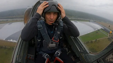 Man experiencing large overloads, hold head, he is bad. First time of pilot. Stock Footage 118677756