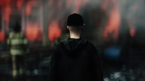 Man Experiencing Loss of Home Standing in Front of Burning Home 스톡 동영상 336516142
