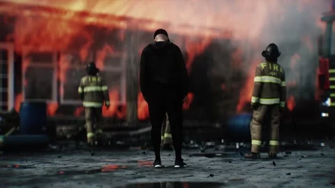 Man Experiencing Loss of Home Standing in Front of Burning Home 스톡 동영상 336516145