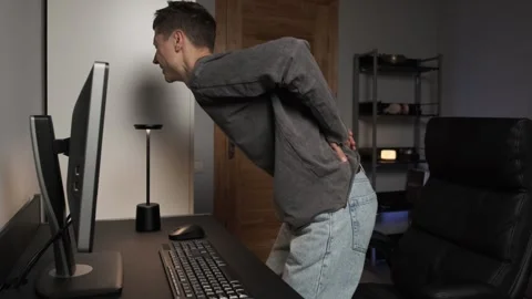 Man experiencing lower back pain office ... | Stock Video | Pond5