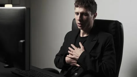 Man experiencing panic attack at work office stress anxiety mental health crisis Stock Footage 317946000