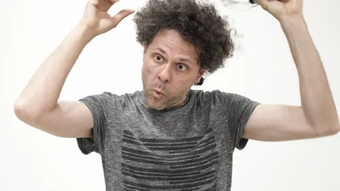 Man experiencing virtual reality headset isolated on white background 스톡 동영상 309772398