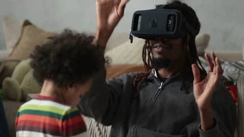 Man experiencing virtual reality with VR headset Stock Footage 73889337