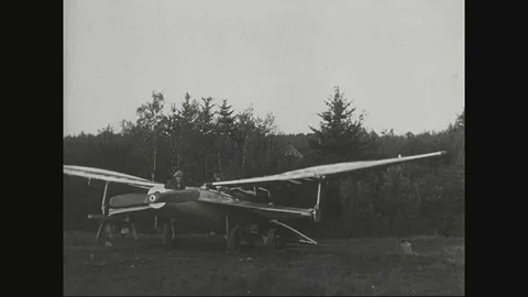 Man experiments with basic manmade wings - 1903 Video stock 90459713