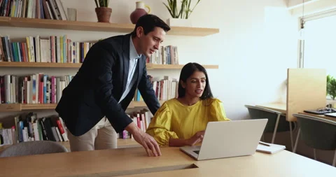 Man explain to colleague new project, share ideas in office Stock Footage 260597028