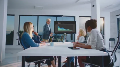 Man explaining colourful charts Stock Footage 168276487