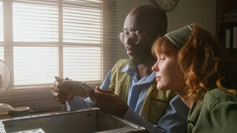 Man Explaining Computer Hardware to Woman Stock Footage 341418208