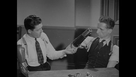 Man explaining difference between artificial limbs for amputations, 1944, UK Stock Footage 130664370