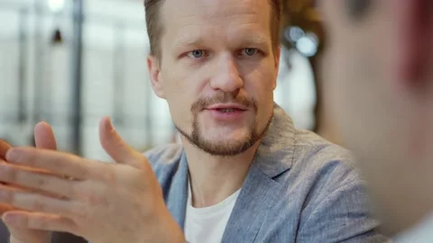 Man explaining points to business partner Stock Footage 142472461