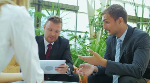 The man explains colleagues plan for the future work Stock Footage 57457705