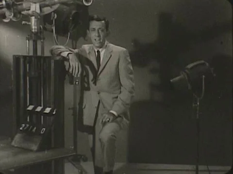 A man explains some of the backbone elements on the decisions made in making a Stock Footage 75293053