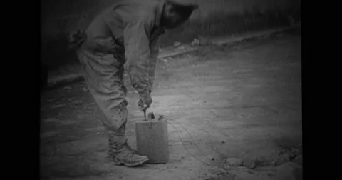 Man exploding building with dynamite plunger Stock Footage 43503913