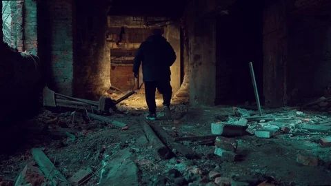 Man explorer with flashlight inside corridor or tunnel of ruined industrial Stock Footage 121538427