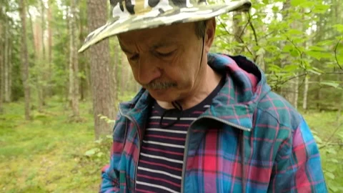 Man explorer searching direction with compass in summer forest Stock Footage 112243628