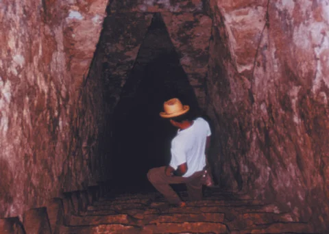 Man explores deep cave Stock Photos