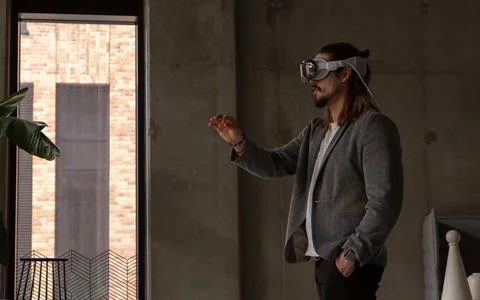 A man explores the potential of spatial computing with an AR headset Stock Photos