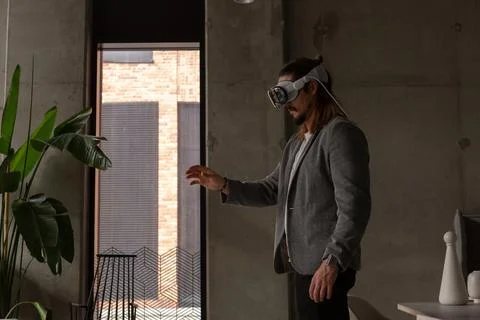 A man explores the potential of spatial computing with an AR headset Stock Photos