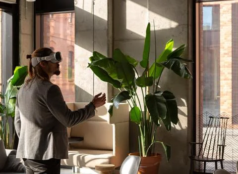 A man explores the potential of spatial computing with an AR headset Stock Photos