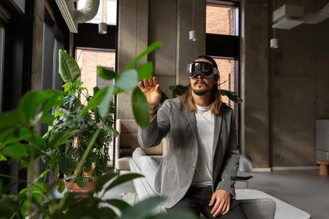 A man explores the potential of spatial computing with an AR headset Fotos Stock