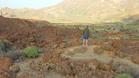 Man explores Teide's Mars-like realm, an otherworldly hike Stock Footage 247696953
