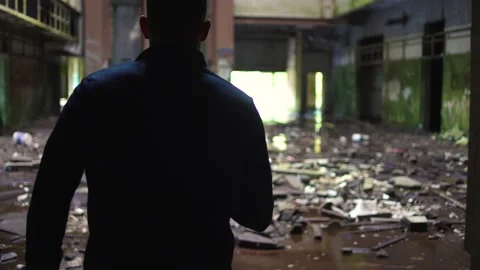 Man exploring an abandoned hotel in ruins Stock-Footage 237692061