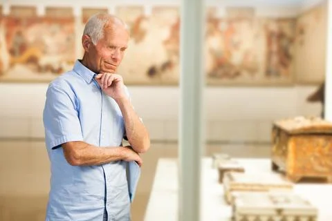 Man exploring artworks in museum Stock Photos