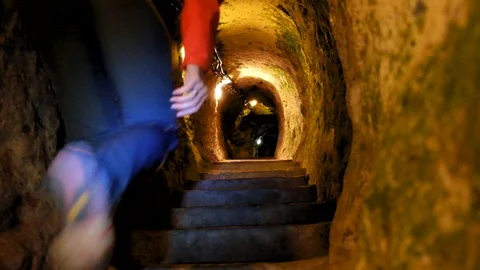 Man exploring caves in Kaymakli underground city Stock Footage 90724129