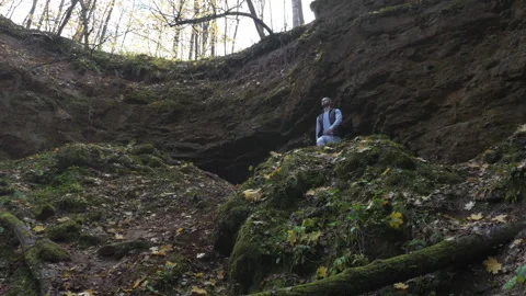 Man Exploring Dense Forest Landscape Cinematic Shot Stock Footage 264670501
