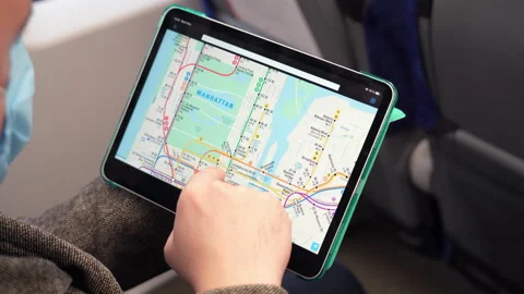 Man exploring New York subway map on tablet computer in train. NOV 12 2020 New Stock Footage 168104827