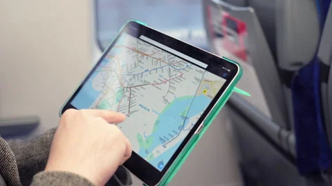 Man exploring New York subway map on tablet computer in train. NOV 12 2020 New Stock Footage 168242919