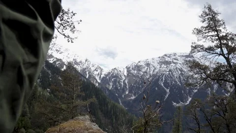 Man Exploring a Scenic Himalayan Landscape With Snowy Mountain Peaks Stock Footage 344015330