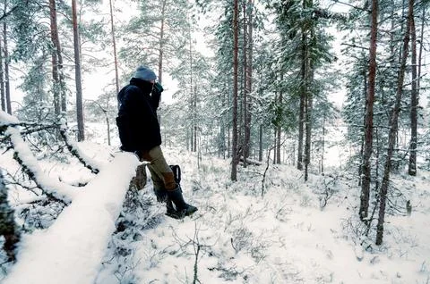 Man Exploring Snowy Forest Stock Photos