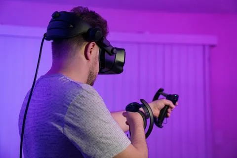 Man exploring virtual space through VR headset Stock Photos