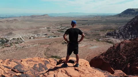 Man expresses freedom. Concept of being king of the world Vídeo Stock 233436499