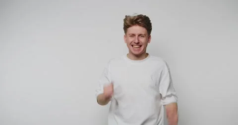 Man expresses joy through dance and gestures in a simple indoor setting dur.. Stock-Footage 328248451