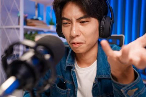 Man expressing frustration while podcasting Stock Photos