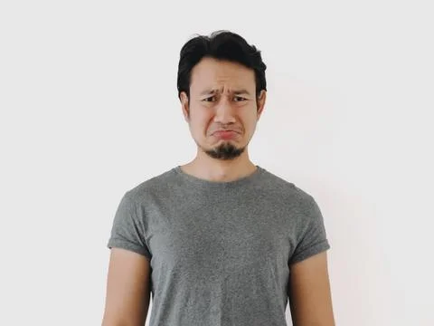 A Man Expressing His Deep Sadness in a Minimalist Setting with Various Emot.. Stock-Fotos