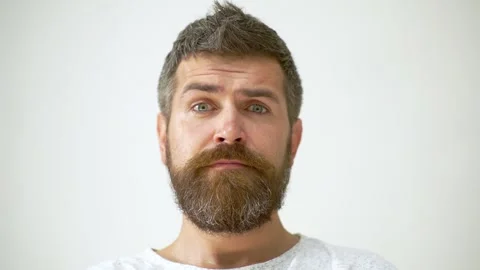 Man expressing his feelings and facial expressions. Man Facial Emotions. Male Stock-Footage 290377740