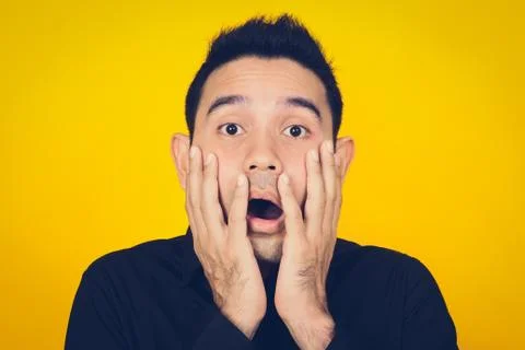 A man expressing shocked and scared face Stock Photos