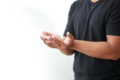 Man extending his hand to something on white background Stock Photos