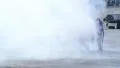 Man extinguishing car fire after crash, accident, thick smoke HD Footage